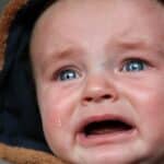 close up photo of crying baby